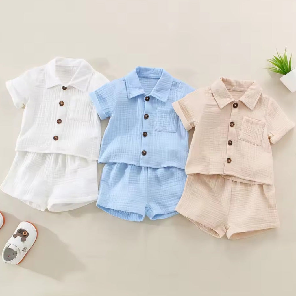 Baby Linen Set - White, Blue, Brown group flat lay