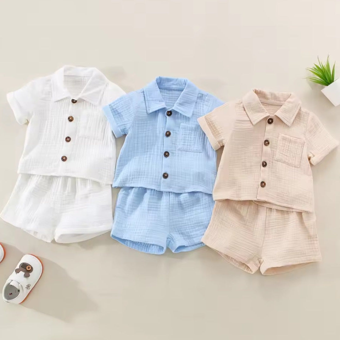 Baby Linen Set - White, Blue, Brown group flat lay