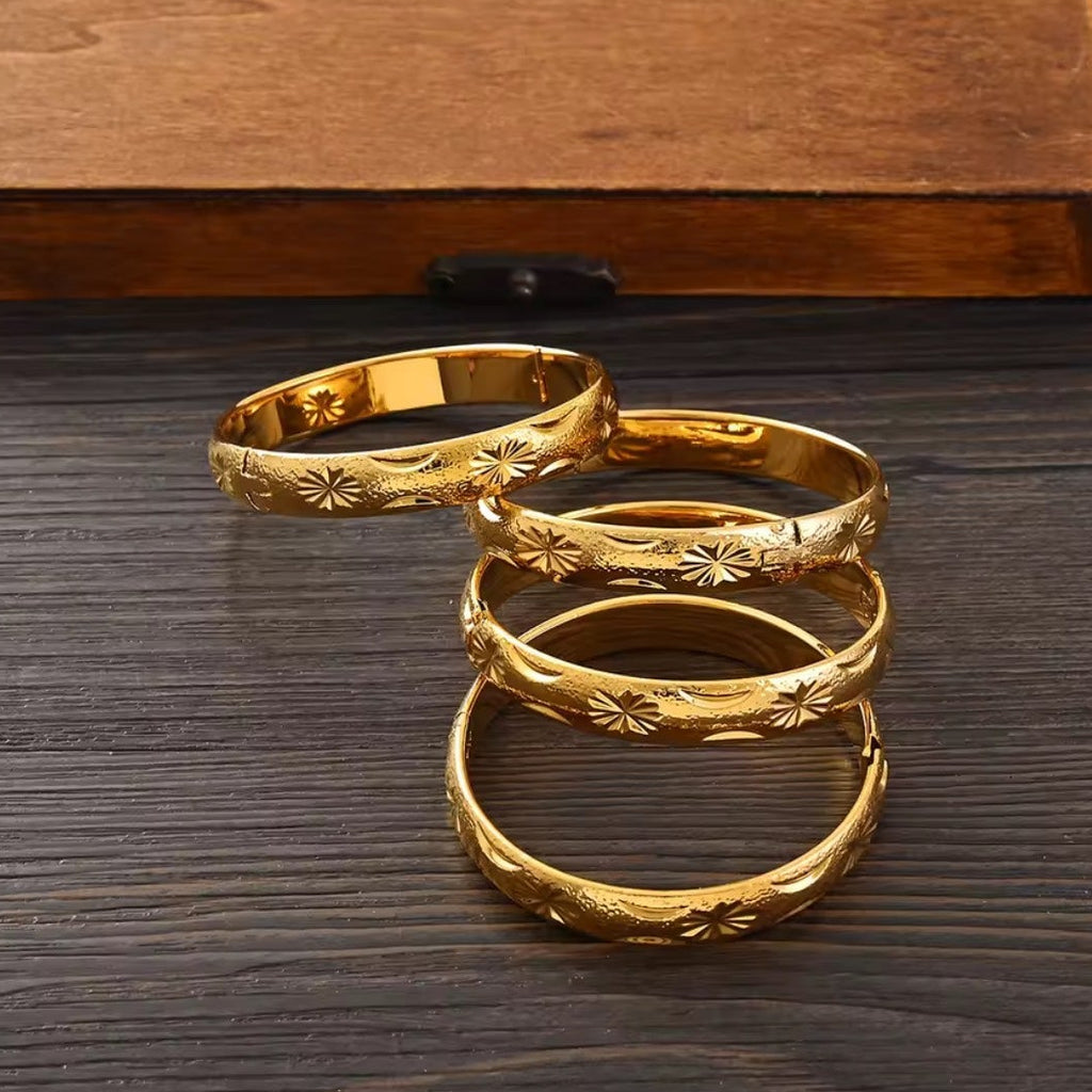 Gold Etched Bangle Set - fanned out on surface
