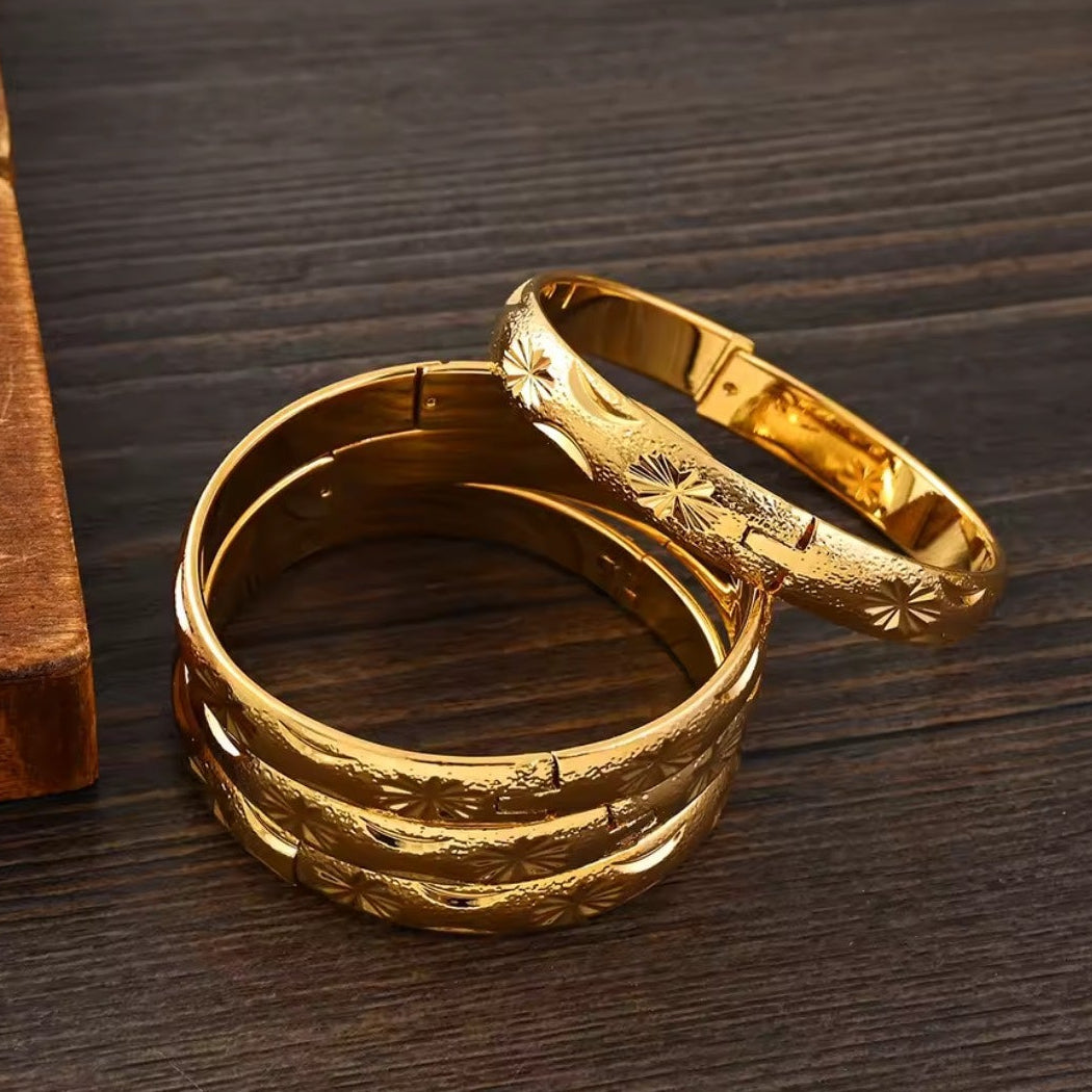 Gold Etched Bangle Set - stacked on surface close up