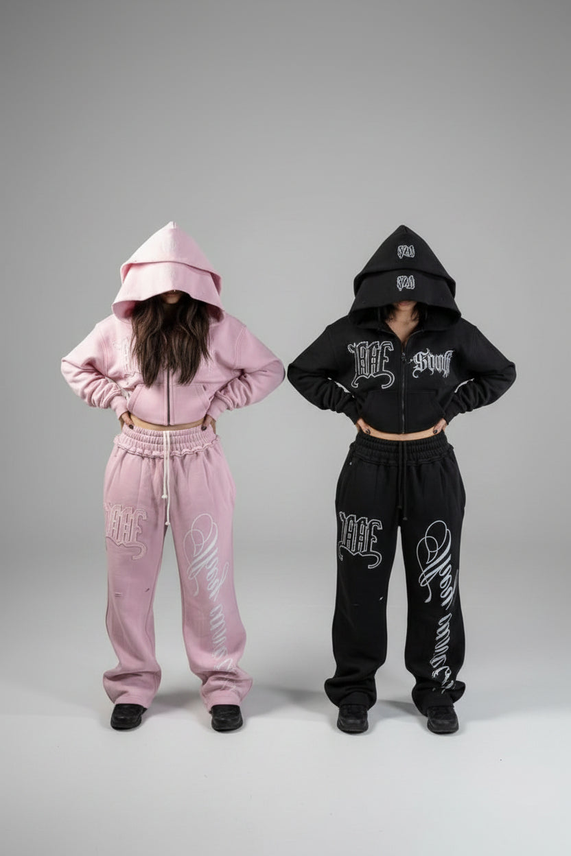 They Can't Be Us pink tracksuit detail