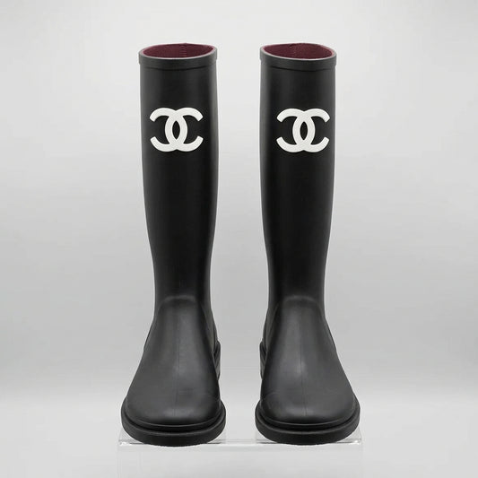 Black tall boots with white CC logo